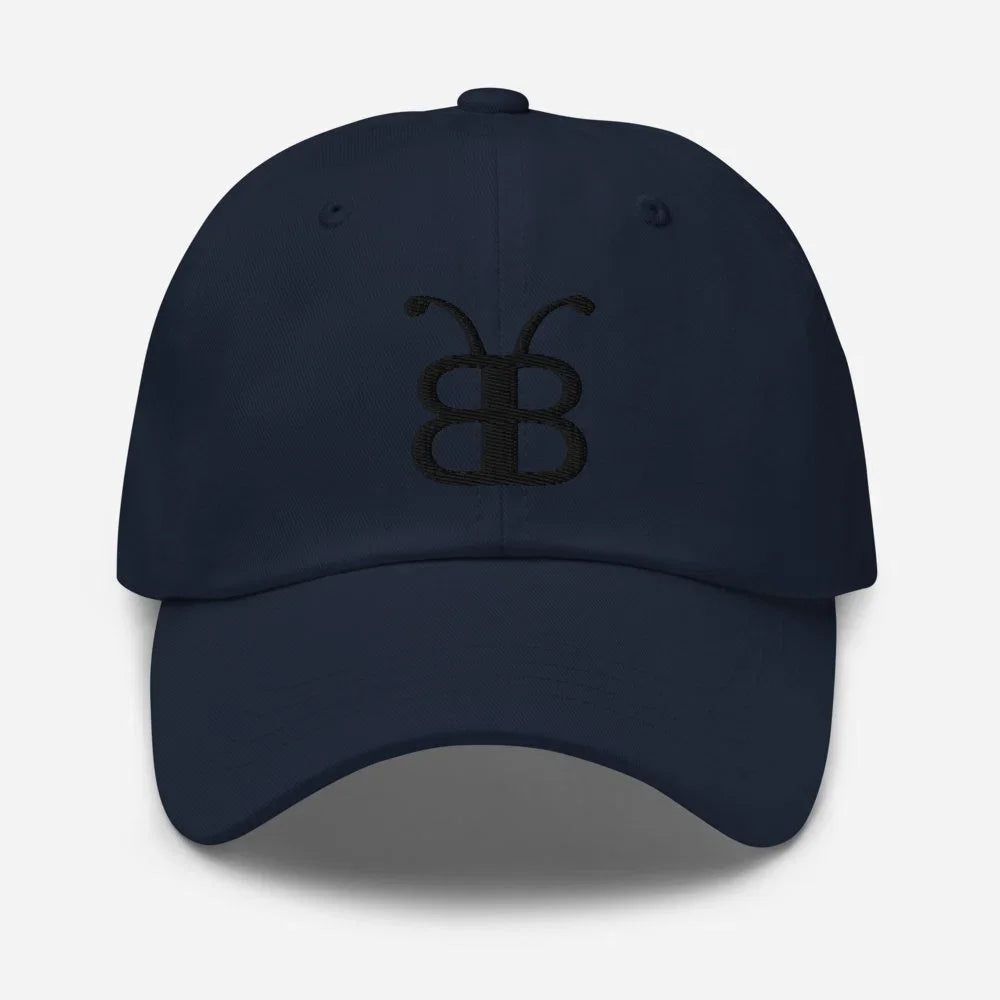 Navy blue dad hat with embroidered butterfly logo, streetwear style, eco-friendly fashion accessory