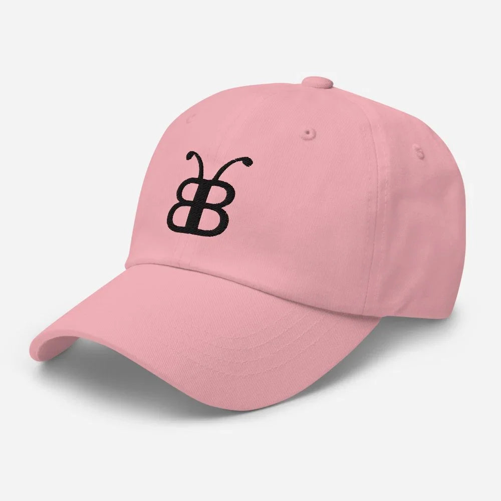 Pink streetwear cap with black butterfly logo, eco-friendly fashion accessory