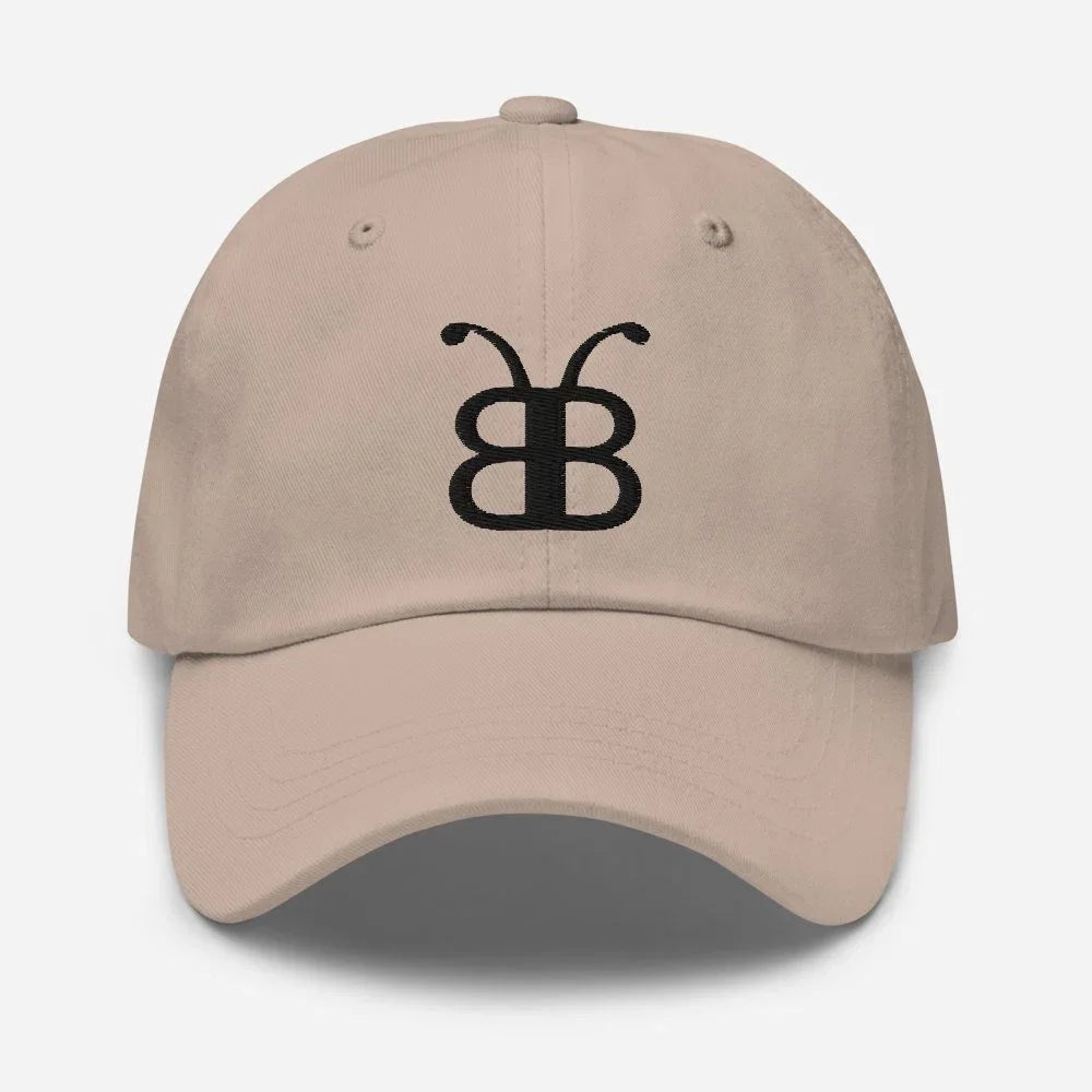 Beige dad hat with black embroidered butterfly logo, streetwear style