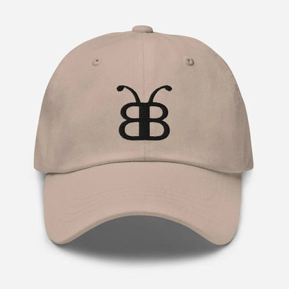 Beige dad hat with black embroidered butterfly logo, streetwear style