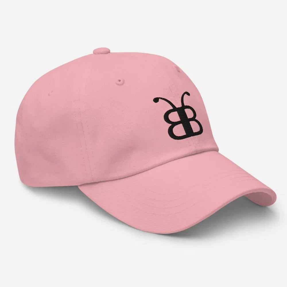 Pink dad hat with black butterfly logo, streetwear style accessory for casual fashion
