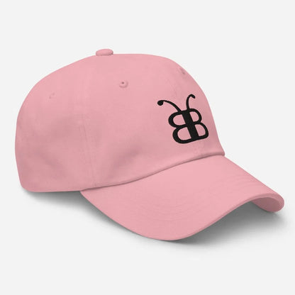 Pink dad hat with black butterfly logo, streetwear style accessory for casual fashion