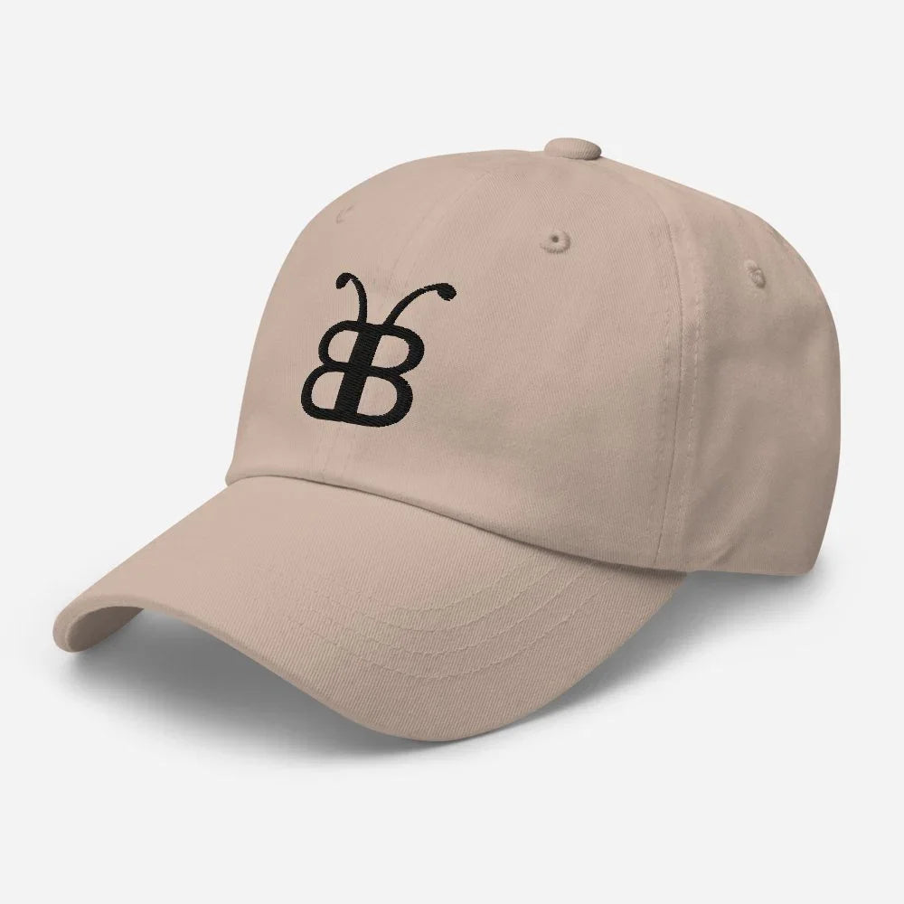 Beige dad hat with black embroidered butterfly logo, streetwear style accessory