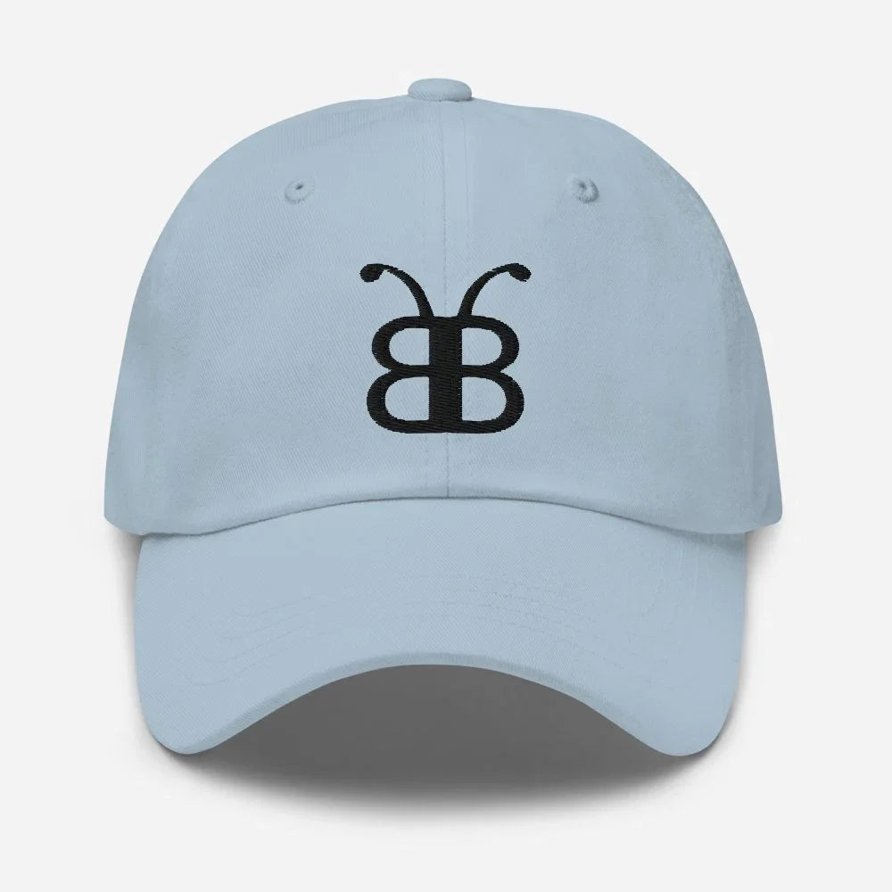 Light blue dad hat with black butterfly logo, streetwear style