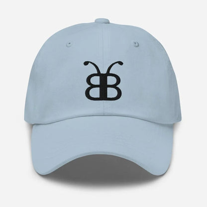 Light blue dad hat with black butterfly logo, streetwear style
