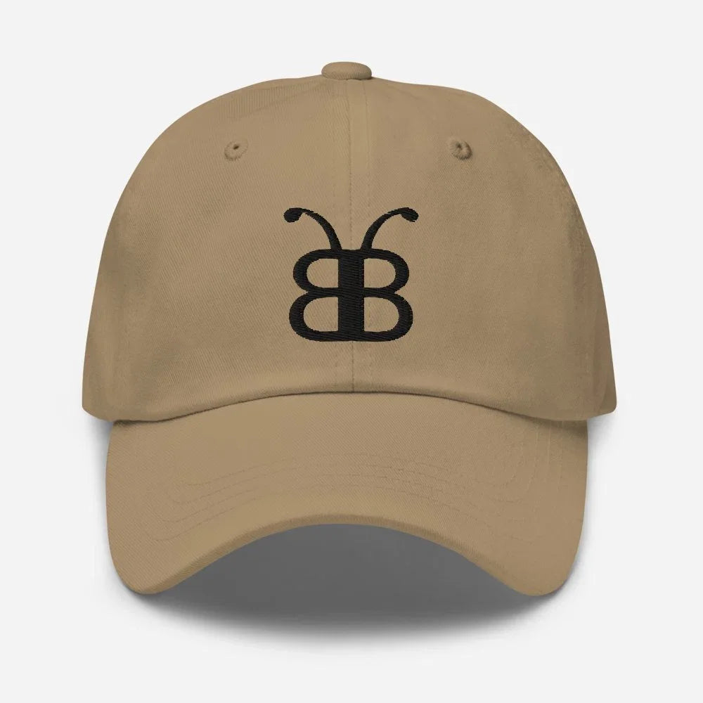 Tan dad hat with black embroidered butterfly logo, streetwear style accessory