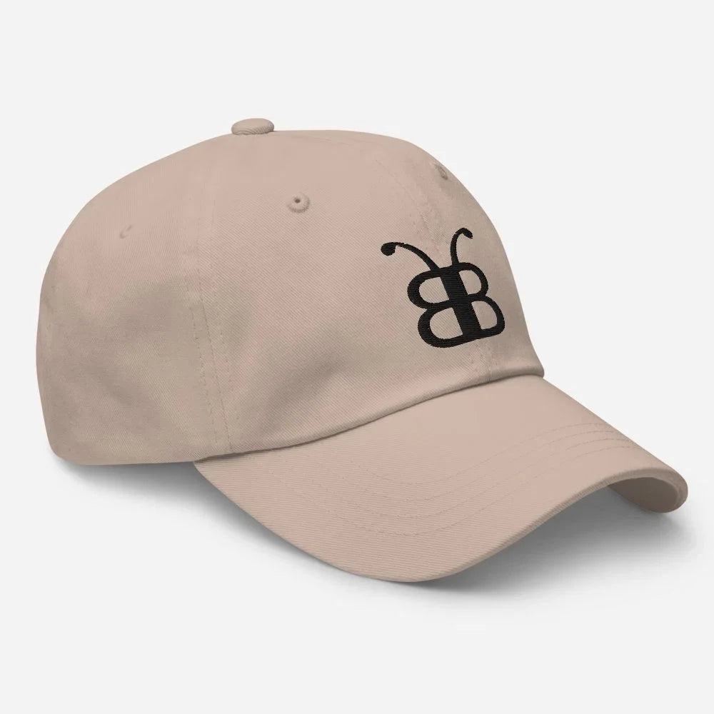 Beige dad hat with black butterfly logo, streetwear style, eco-friendly fashion accessory
