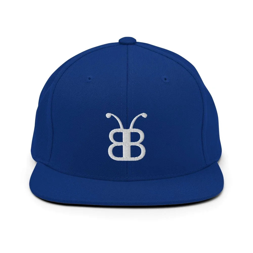 Royal blue snapback hat with white embroidered logo, streetwear style