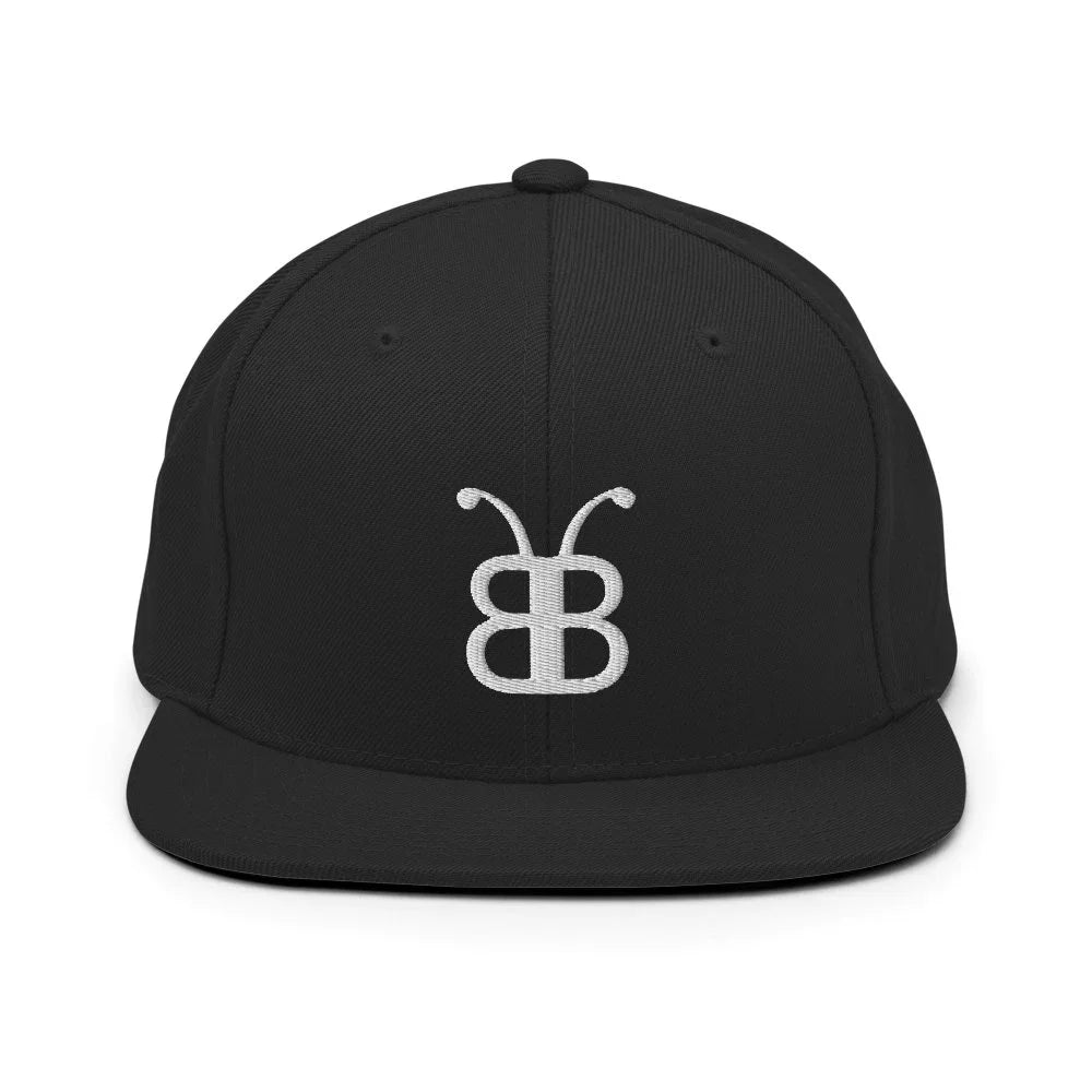 Black snapback hat with white embroidered logo, streetwear style