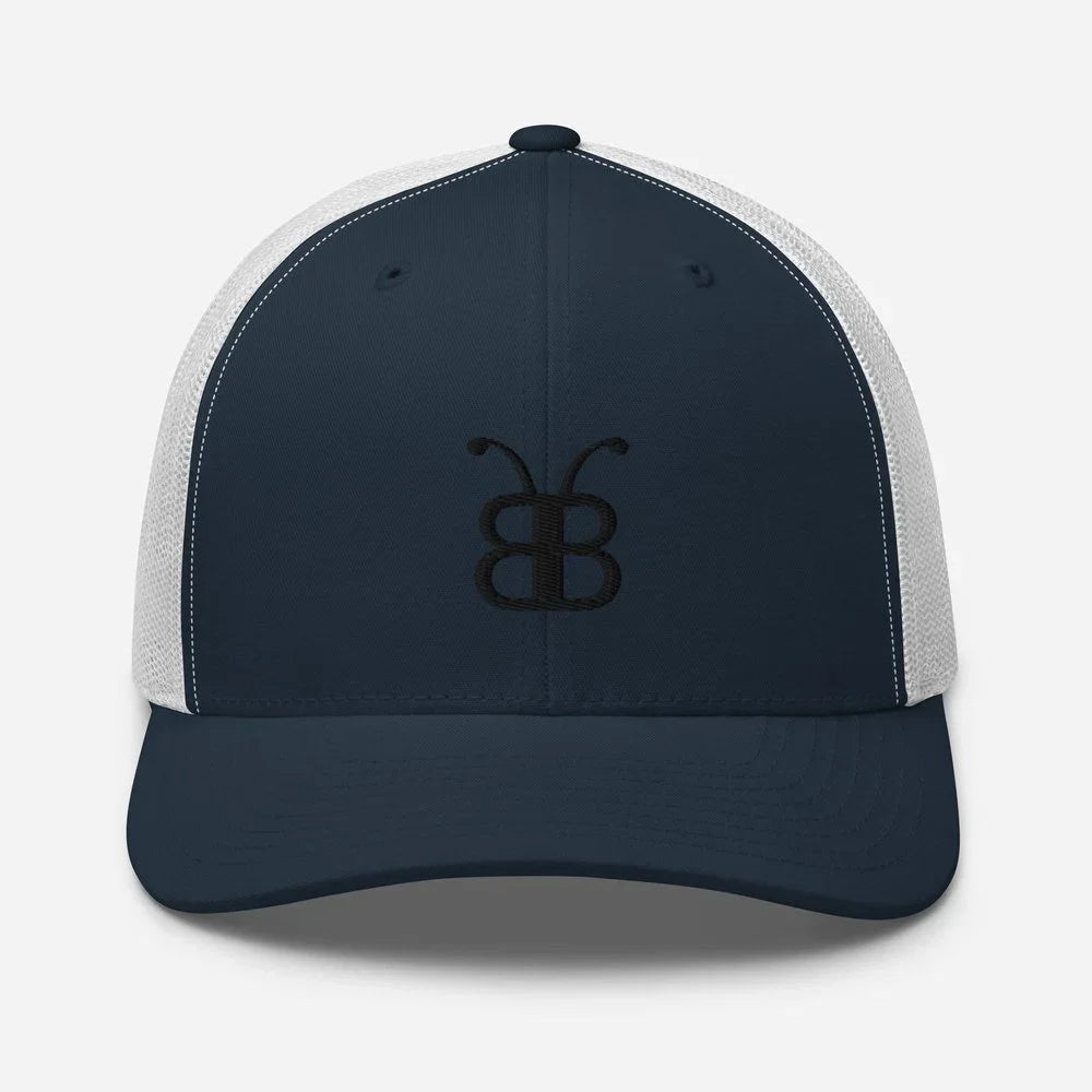Navy blue and white trucker hat with embroidered butterfly logo, streetwear style