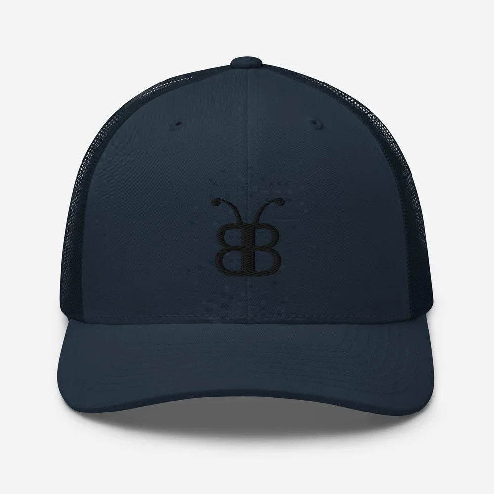 Navy blue trucker hat with embroidered butterfly logo, streetwear style, eco-friendly fashion