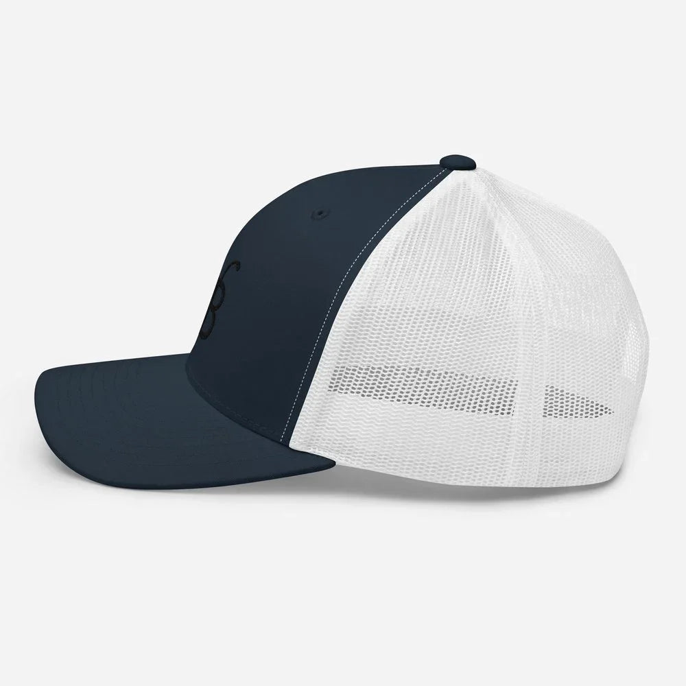 Navy and white trucker hat with embroidered logo, streetwear style cap for men
