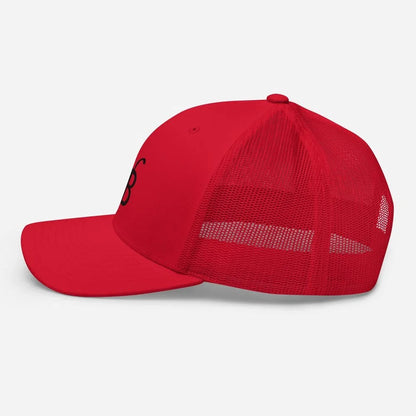 Red trucker hat with black logo, mesh back, flat brim — streetwear fashion
