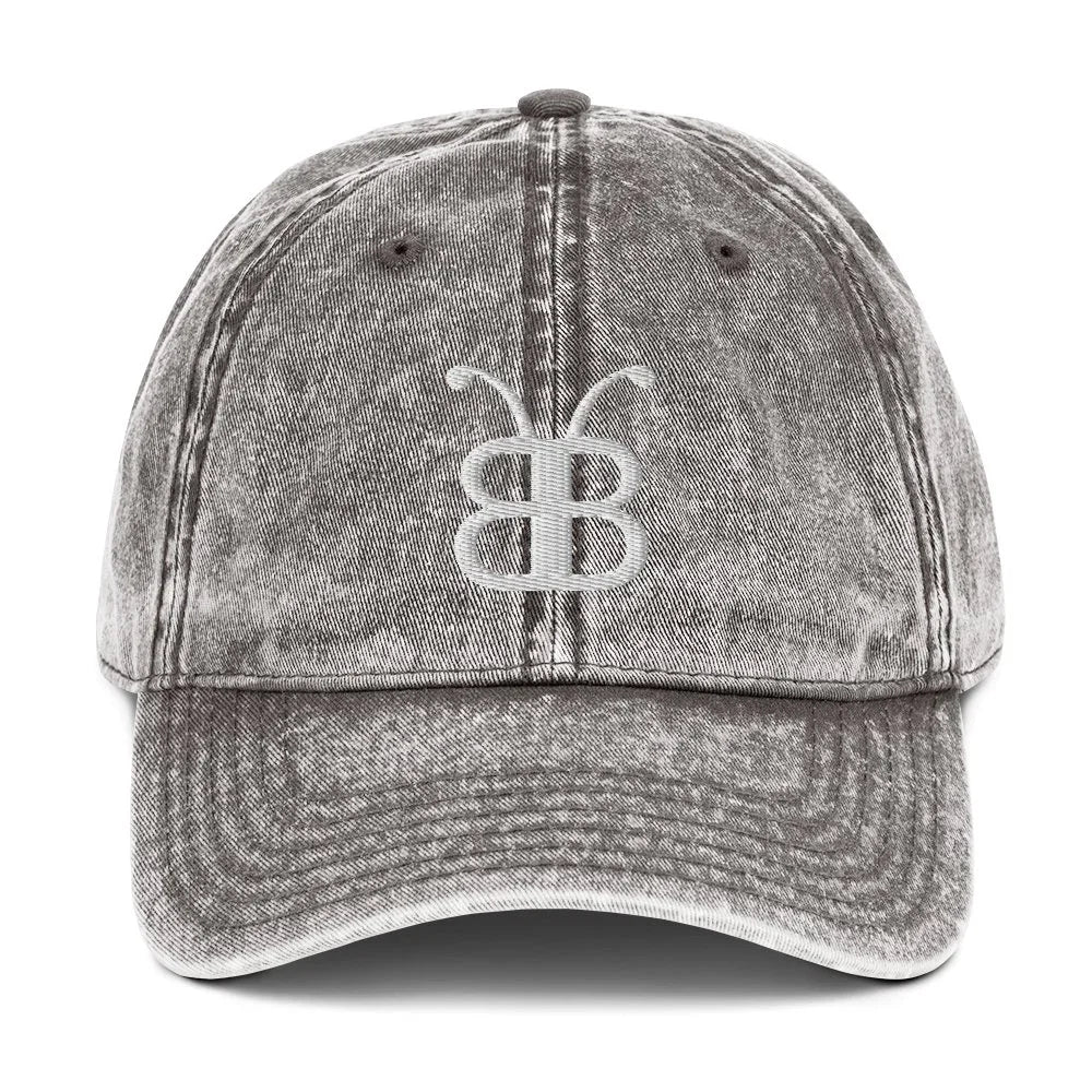 Distressed gray denim dad hat with white butterfly logo, streetwear style