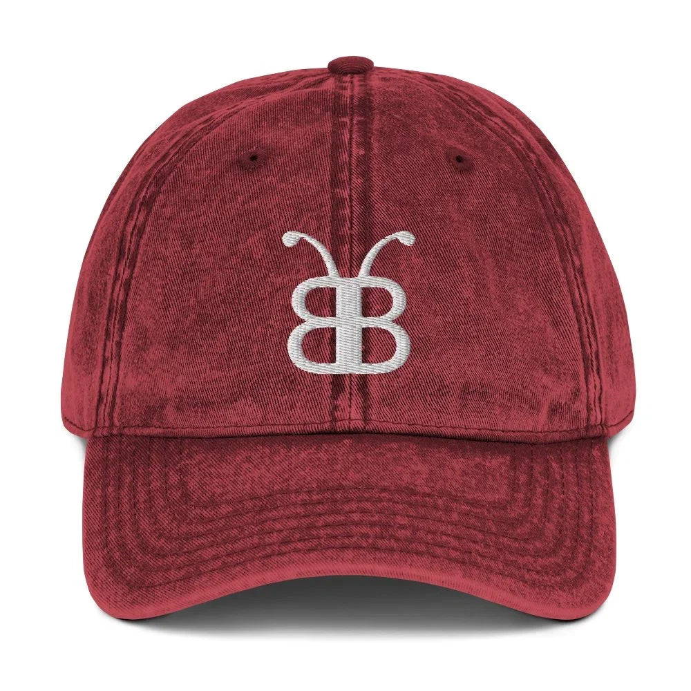 Red distressed dad hat with white embroidered logo, streetwear fashion accessory