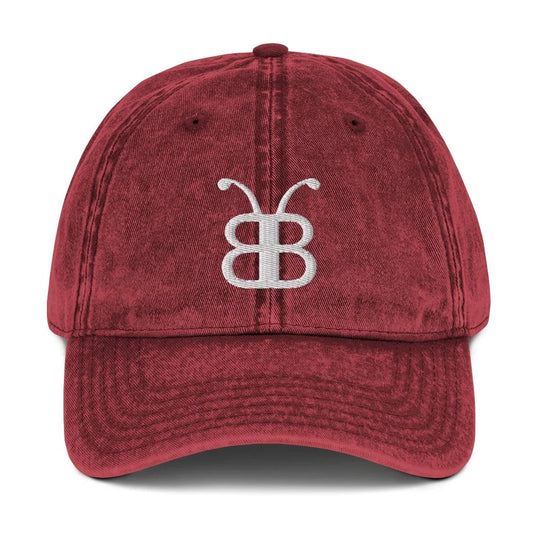 Red distressed dad hat with white embroidered logo, streetwear fashion accessory